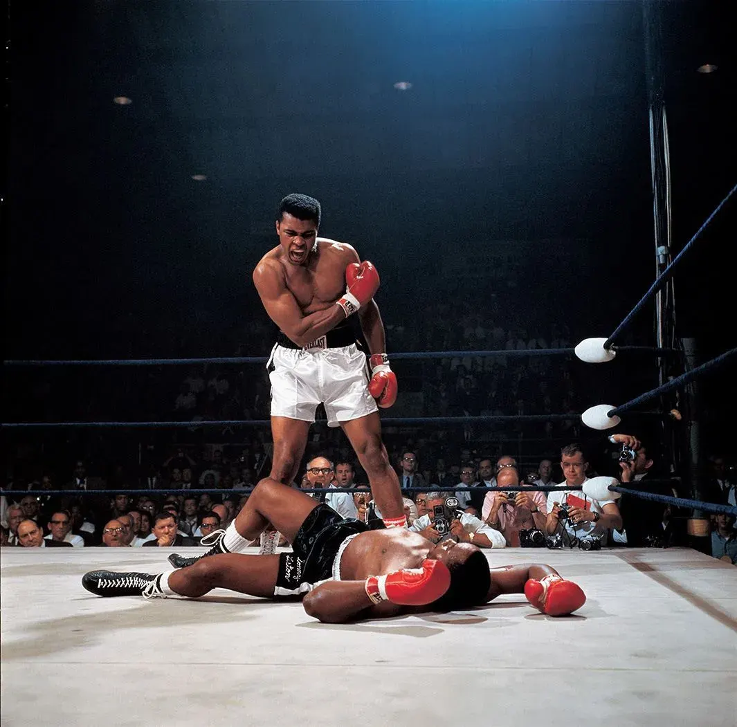 Neil Leifer - Muhammad Ali looking in the mirror while training at 5th Street Gym.Miami Beach, FL, October 9, 1970, printed later